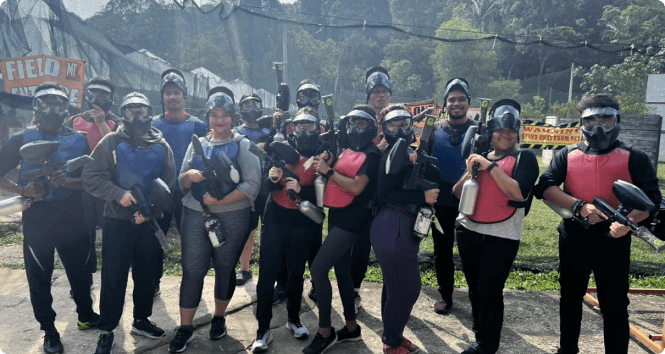 Malaysiakini's staff members dressing long sleeves, loose clothing, and layers for a paintball match